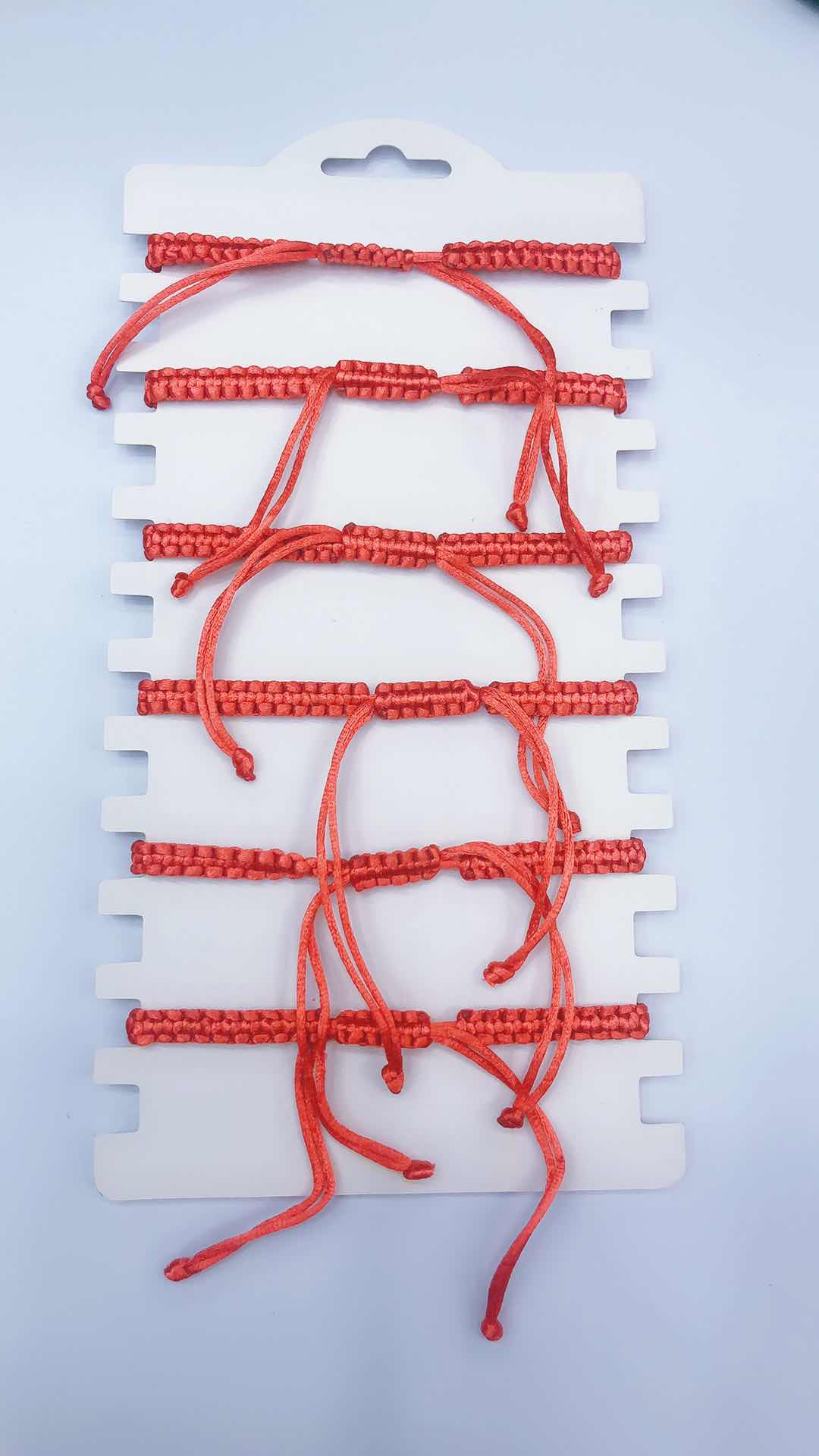 The plain knot woven bracelet is made of alloy with a circular shape and a heart in the middle details Picture