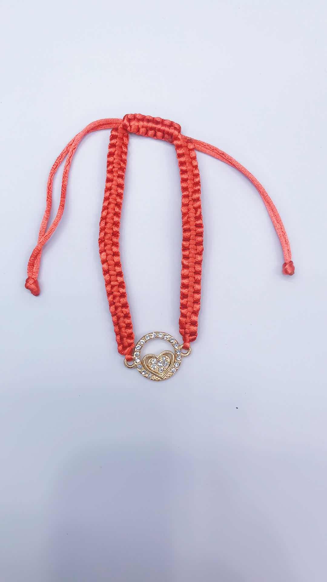 The plain knot woven bracelet is made of alloy with a circular shape and a heart in the middle detail image 4