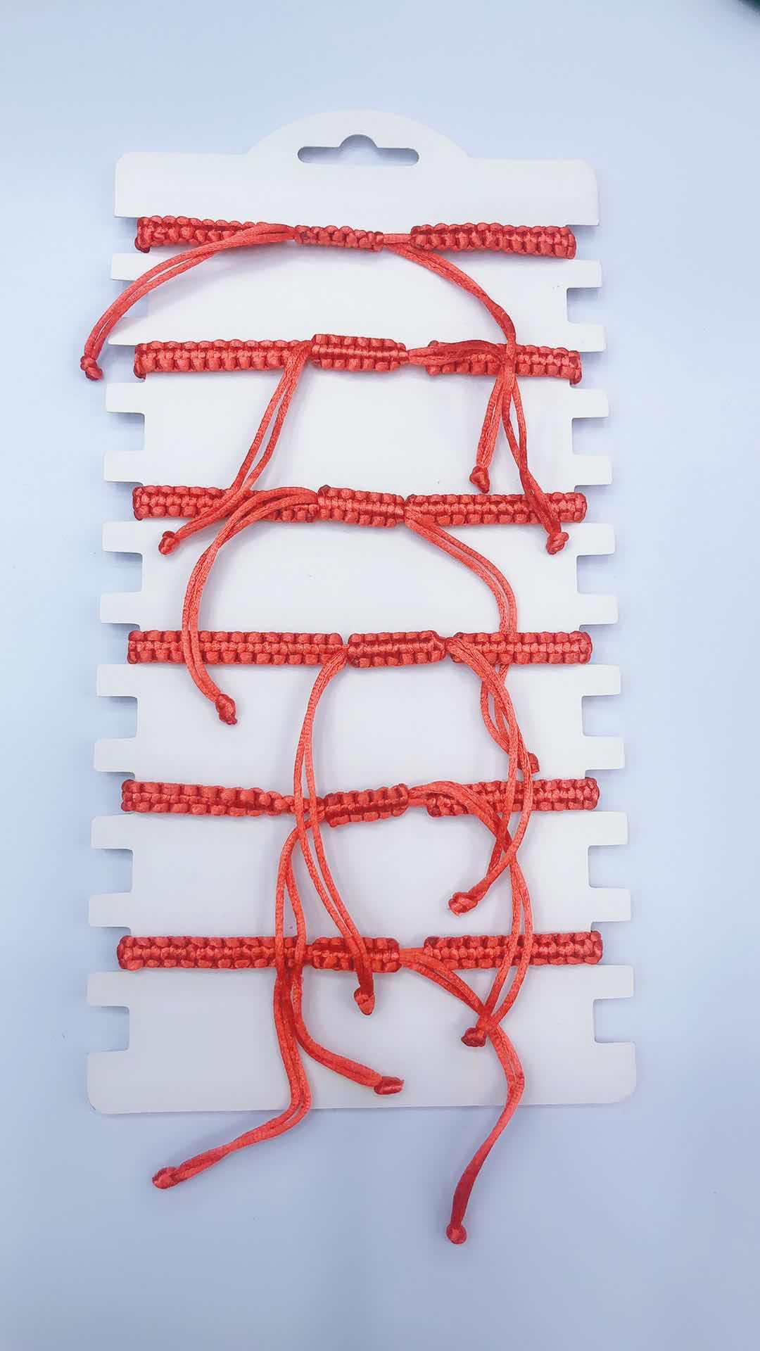 The plain knot woven bracelet is made of alloy with a circular shape and a heart in the middle detail image 2