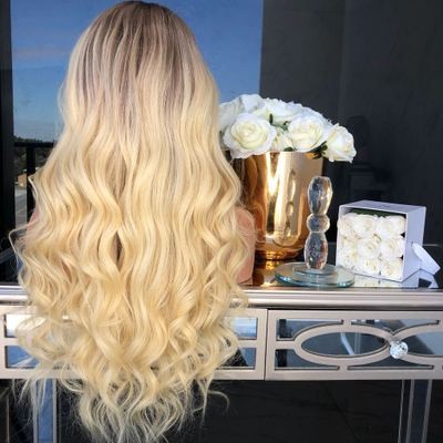 The new wig is made of chemical fiber for European and American women. It features golden yellow mid-parted long curls and slightly curly long straight hair detail image 5