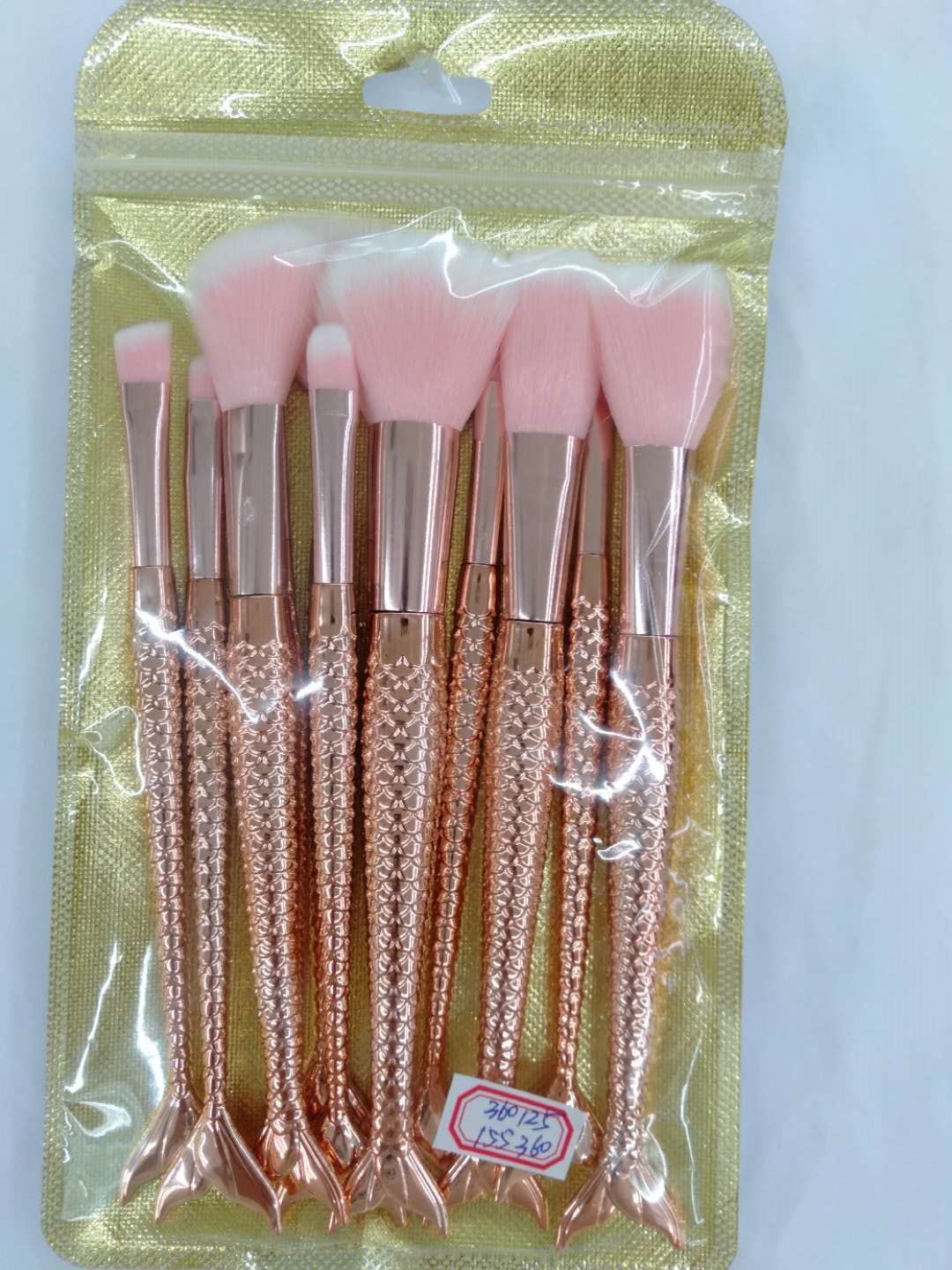 Set of makeup tools: eyeshadow brush, blush brush, eyebrow brush, and loose brush