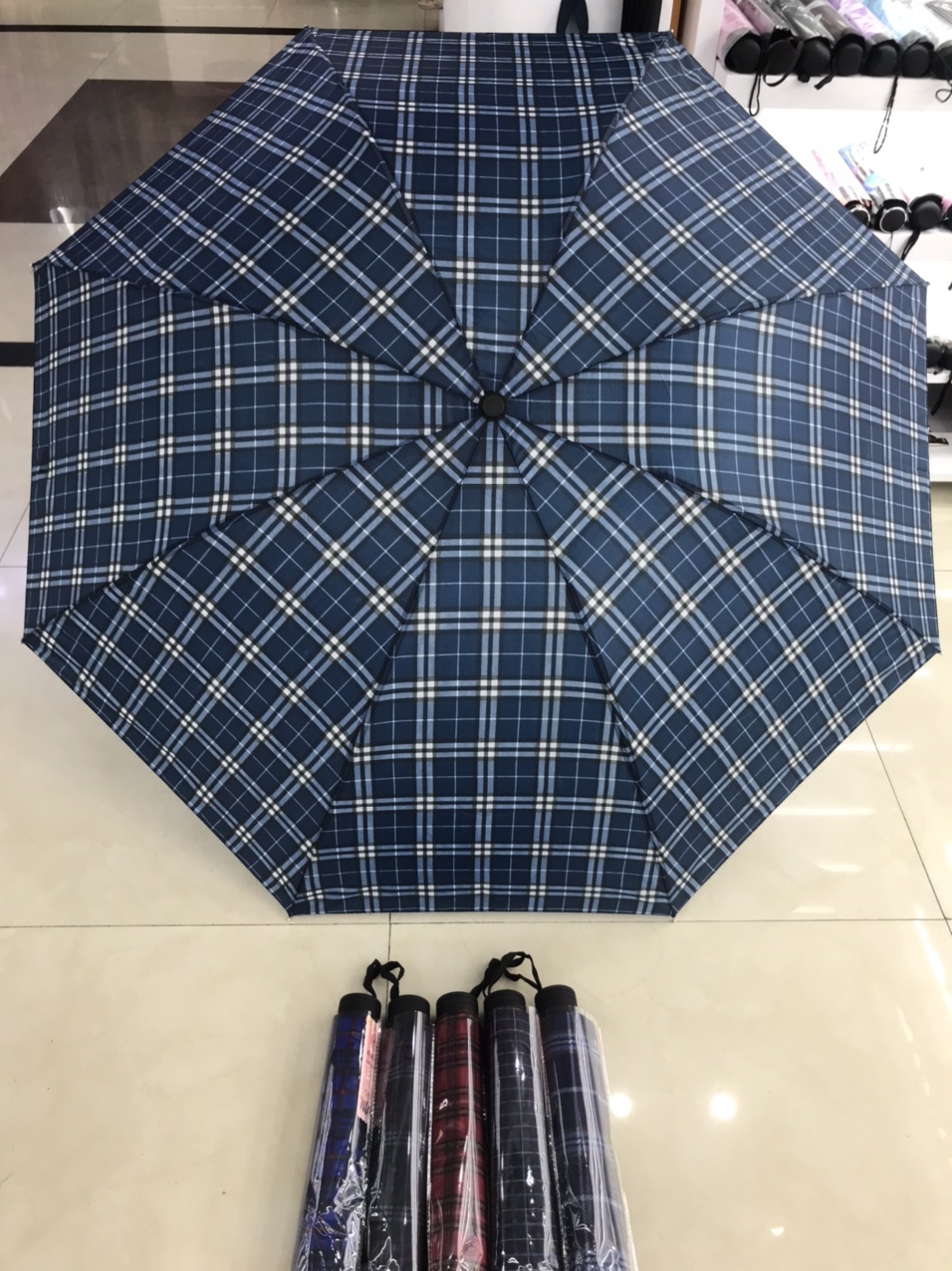 A checkered umbrella for both men and women