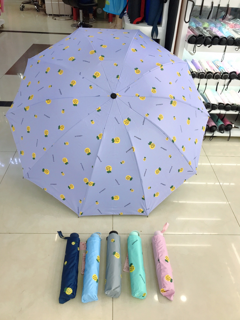 Folding a cartoon-patterned umbrella