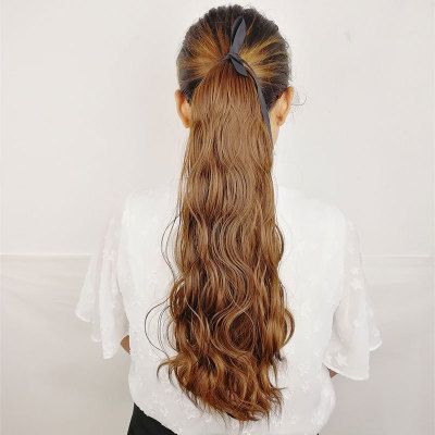 A wig for a woman with a small, corn-trimmed ponytail, a water ripple woolen curly ponytail details Picture
