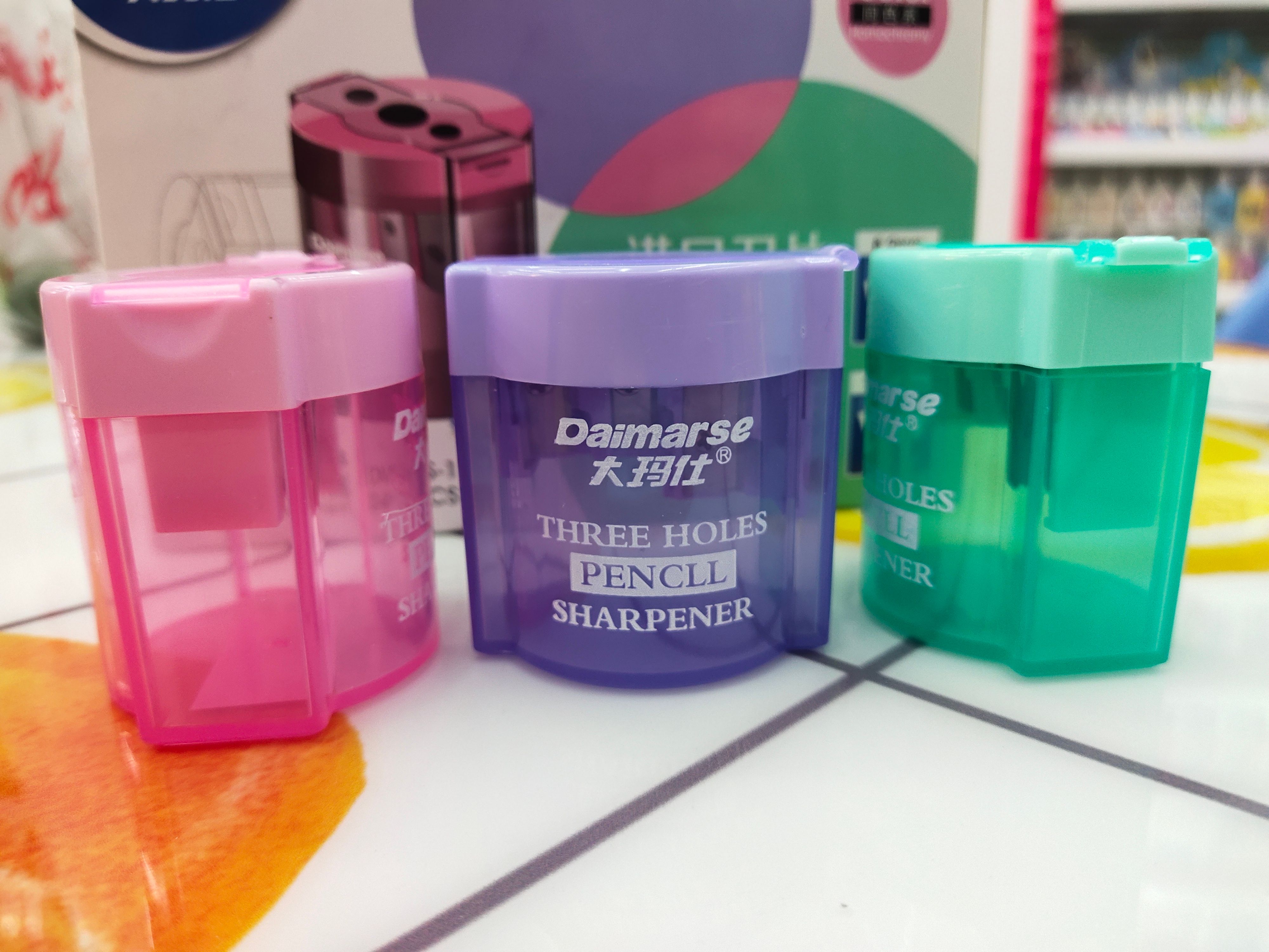 Malaysian 154 three-hole, large and small, three-color mixed pencil sharpener, office and student prize