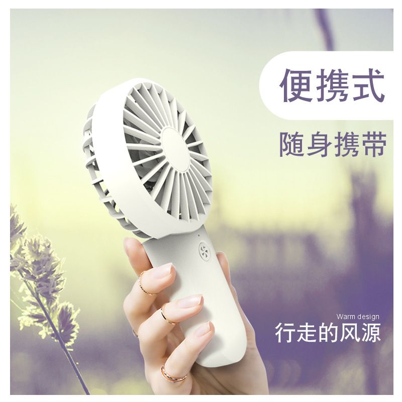 Hand-held small fan, double fan blade, Mini USB charging belt, mobile phone stand, big wind four-speed portable mute fan Application Scenario