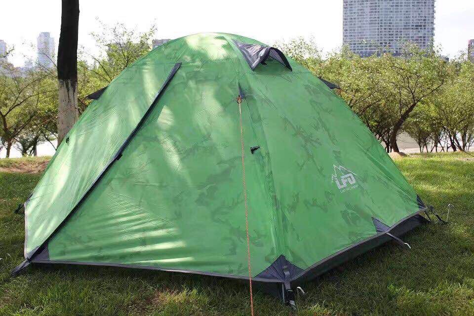 Two people set up a tent with aluminum poles details Picture