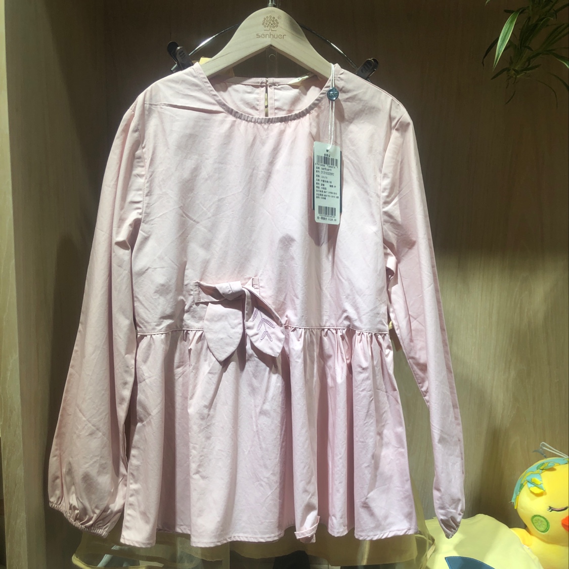 A girl in a long-sleeved blouse