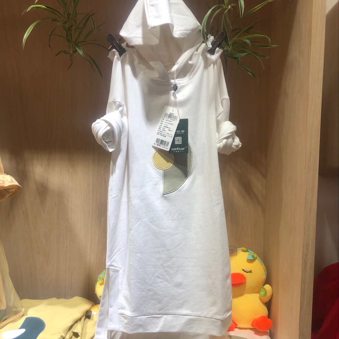 Middle children wear hooded sweatshirts