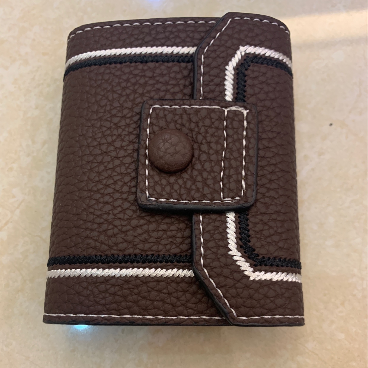 The new card case is in coffee color