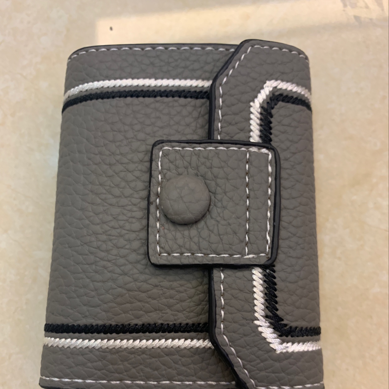 The new card case is grey