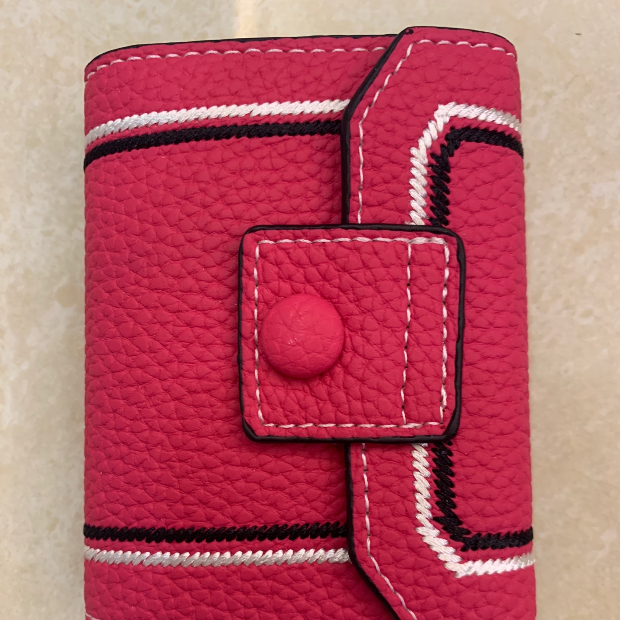 The new card bag is in plum red details Picture