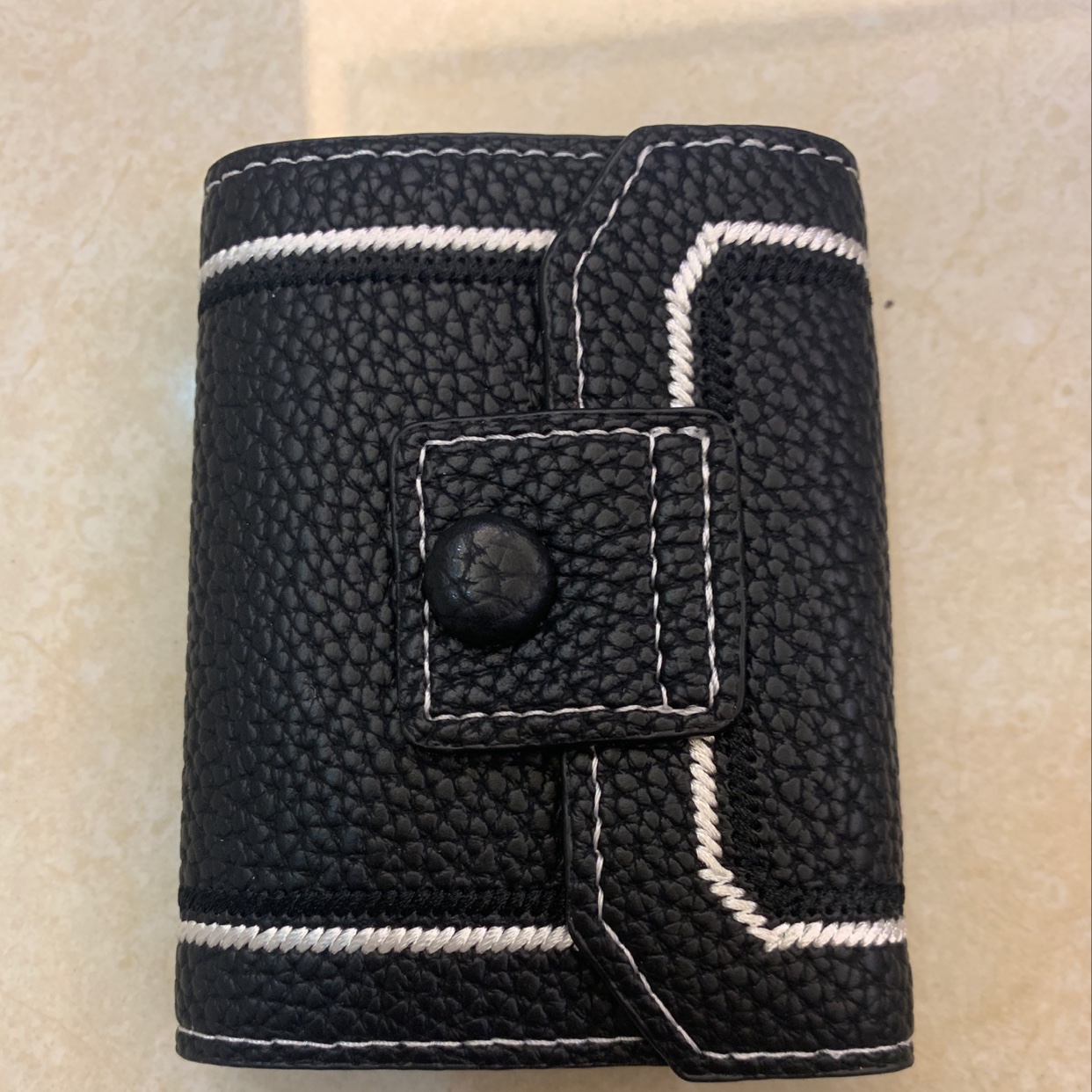 The new card case is black