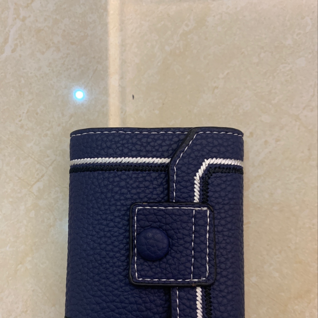 The new card case is in blue details Picture
