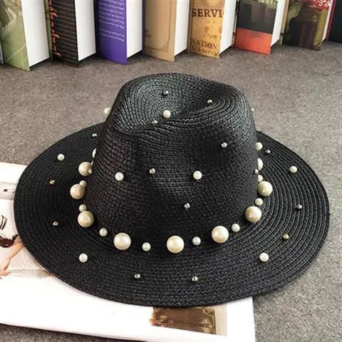 A straw hat with beaded flat brim