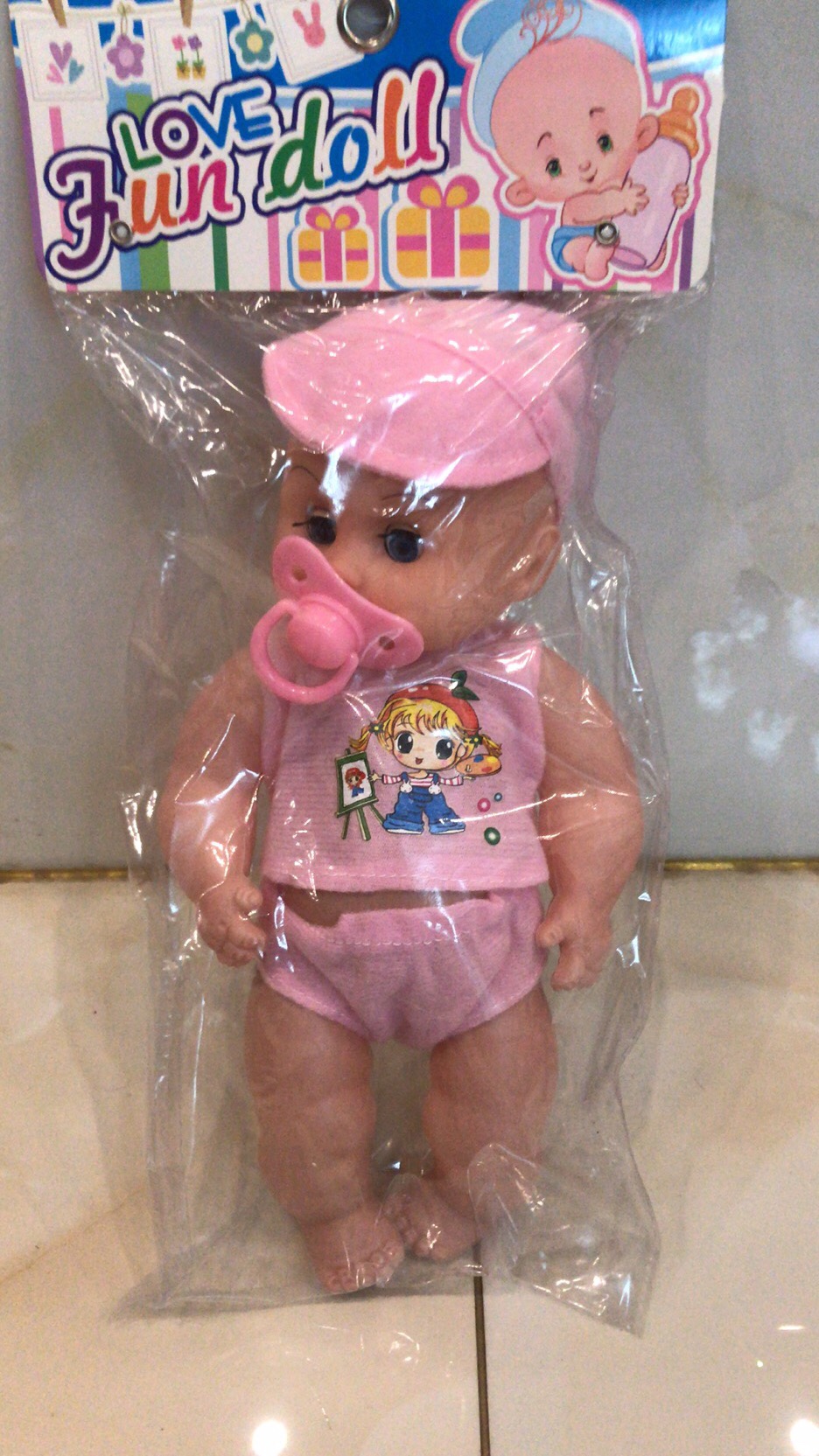 A pacifier doll with music and lights details Picture