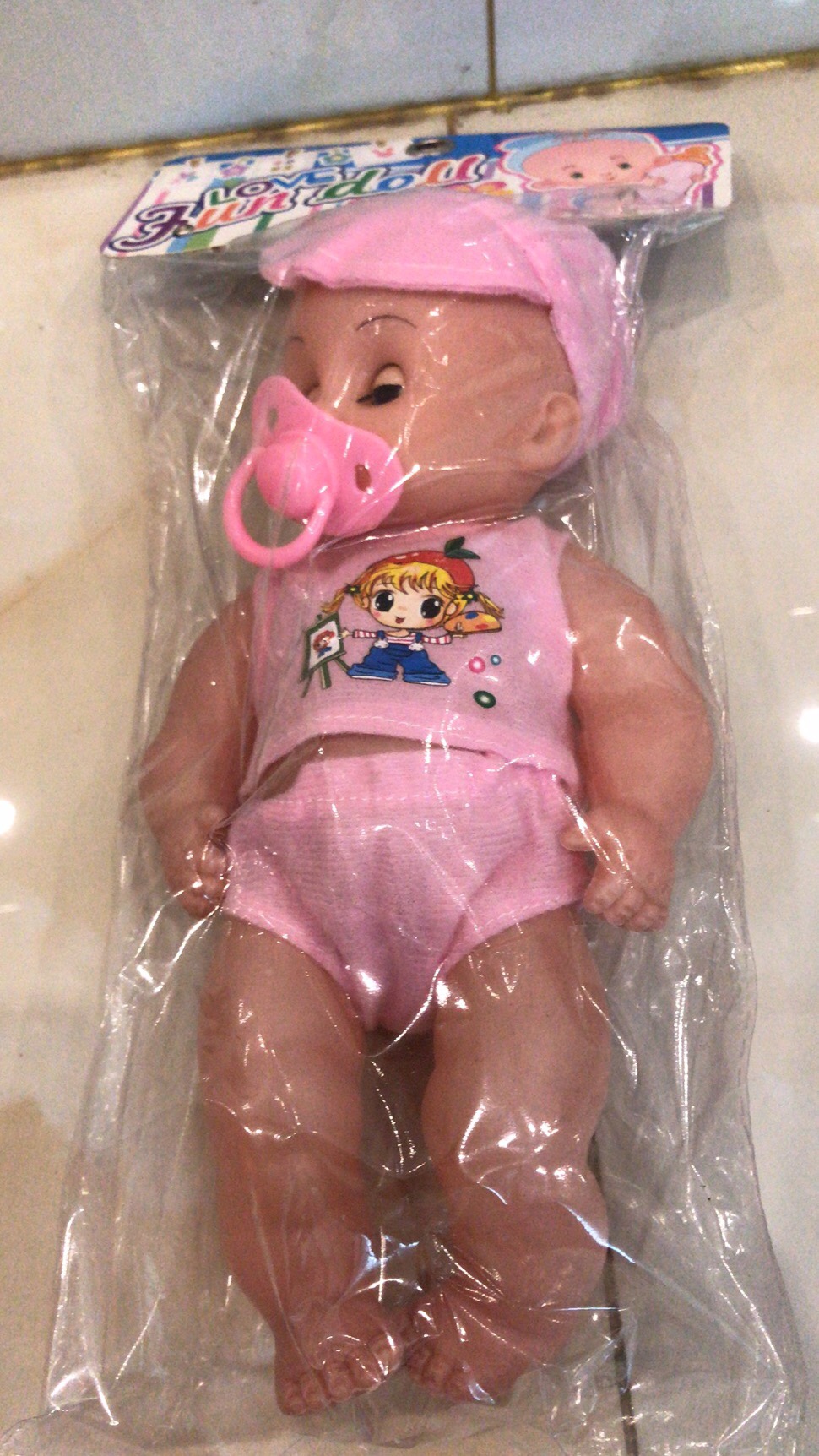 A pacifier doll with music and lights Specification image