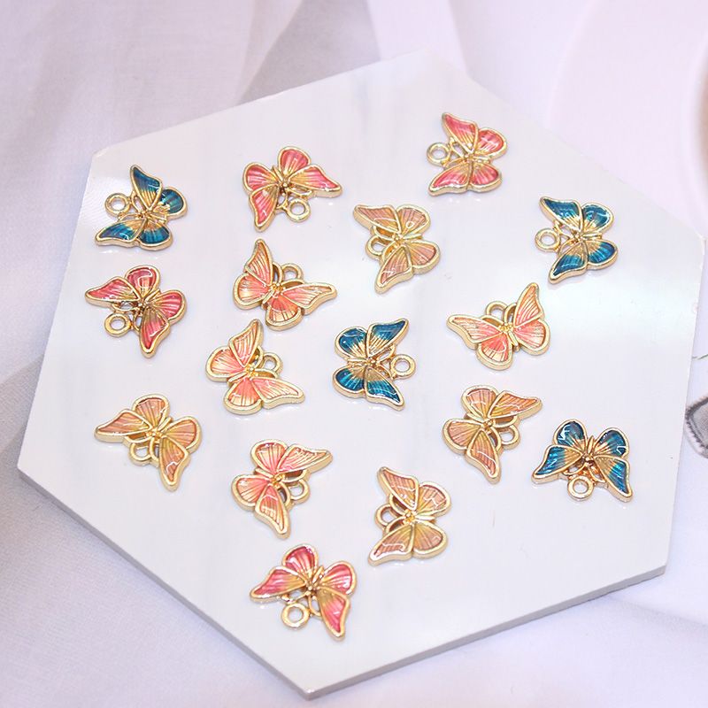 厂家直销DIY饰品配件 时尚滴油双色蝴蝶挂件 手链耳环耳夹小挂饰细节图