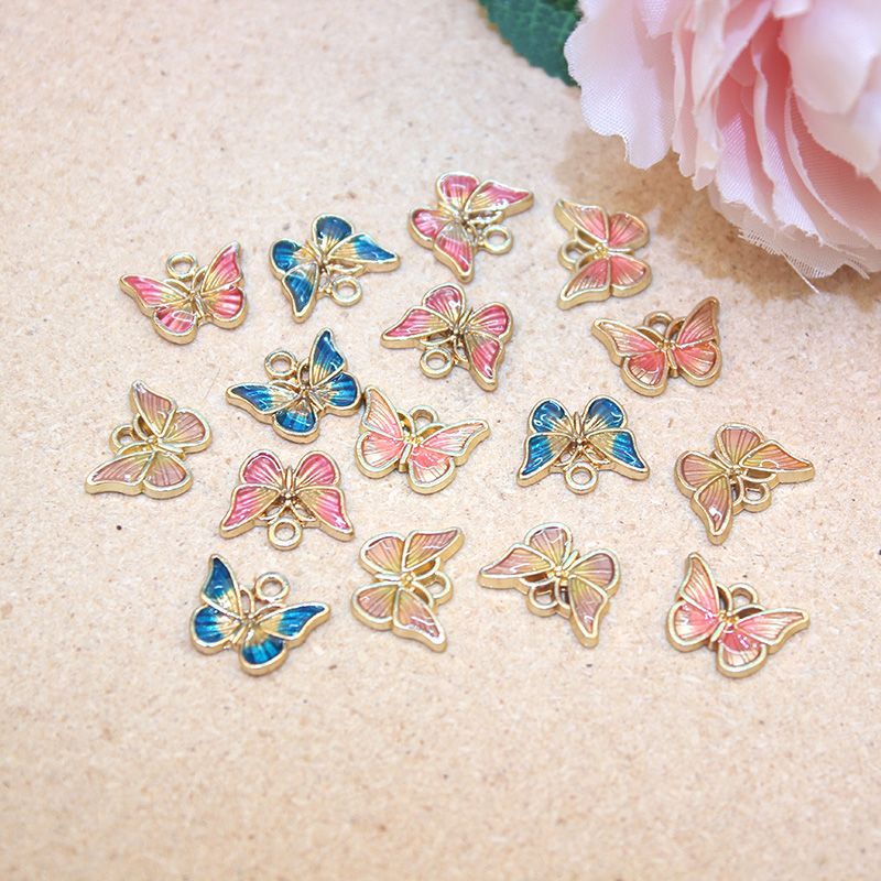 厂家直销DIY饰品配件 时尚滴油双色蝴蝶挂件 手链耳环耳夹小挂饰产品图