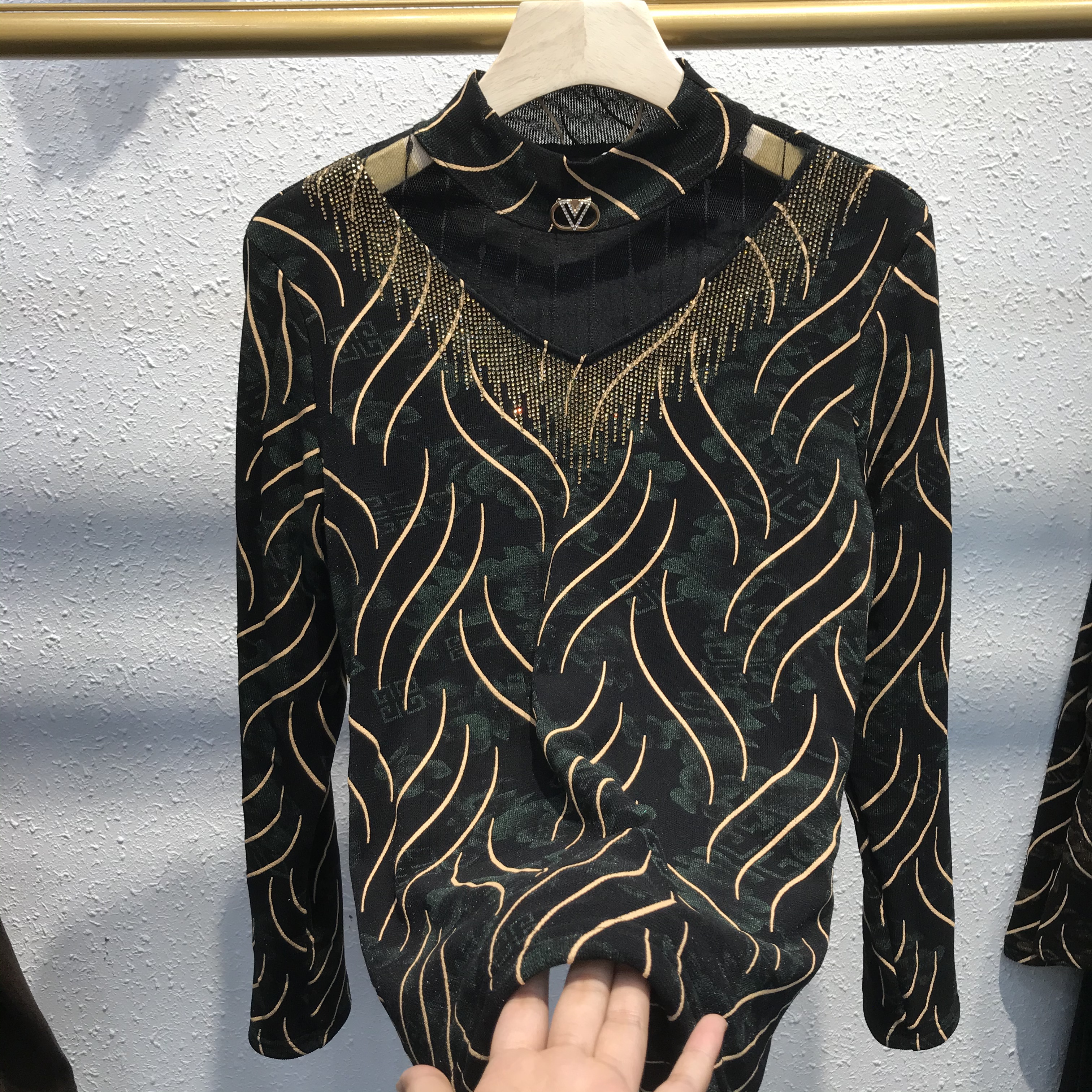 A gold thread and fleece base layer for women's wear details Picture