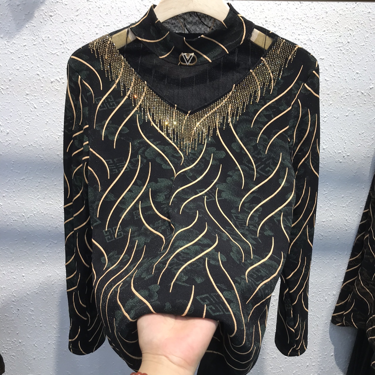 A gold thread and fleece base layer for women's wear
