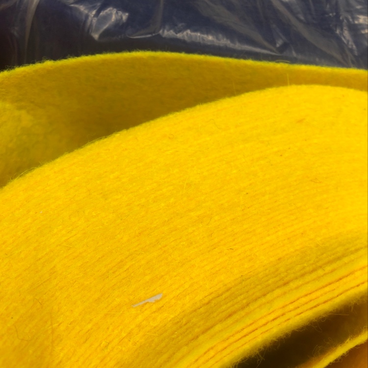 The felt fabric is dark yellow