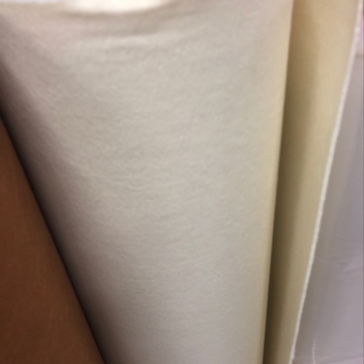 The felt fabric is off-white