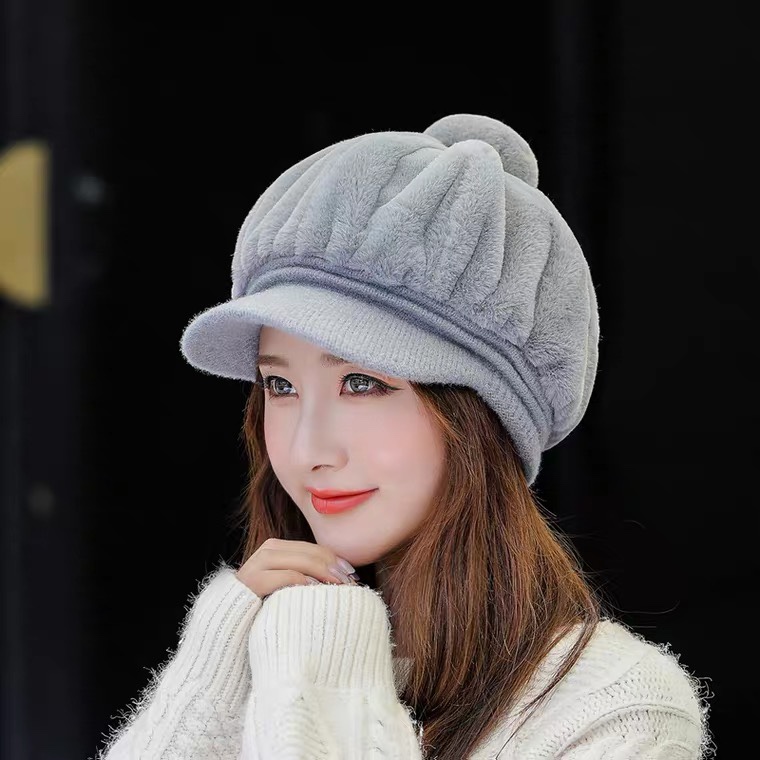 A Korean-style trendy and fashionable hat for women in autumn and winter, with thickened fleece and warmth, is a versatile winter accessory. It features a plush duck tongue knitted woolen cap Item Picture