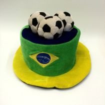 Three football fans in Brazil wear hats