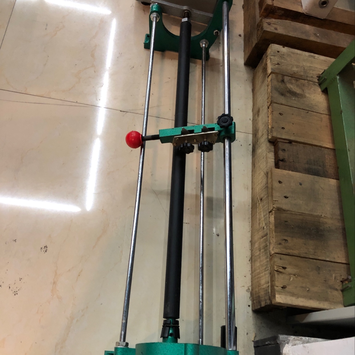 A manual paper cutter is used to cut gold paper