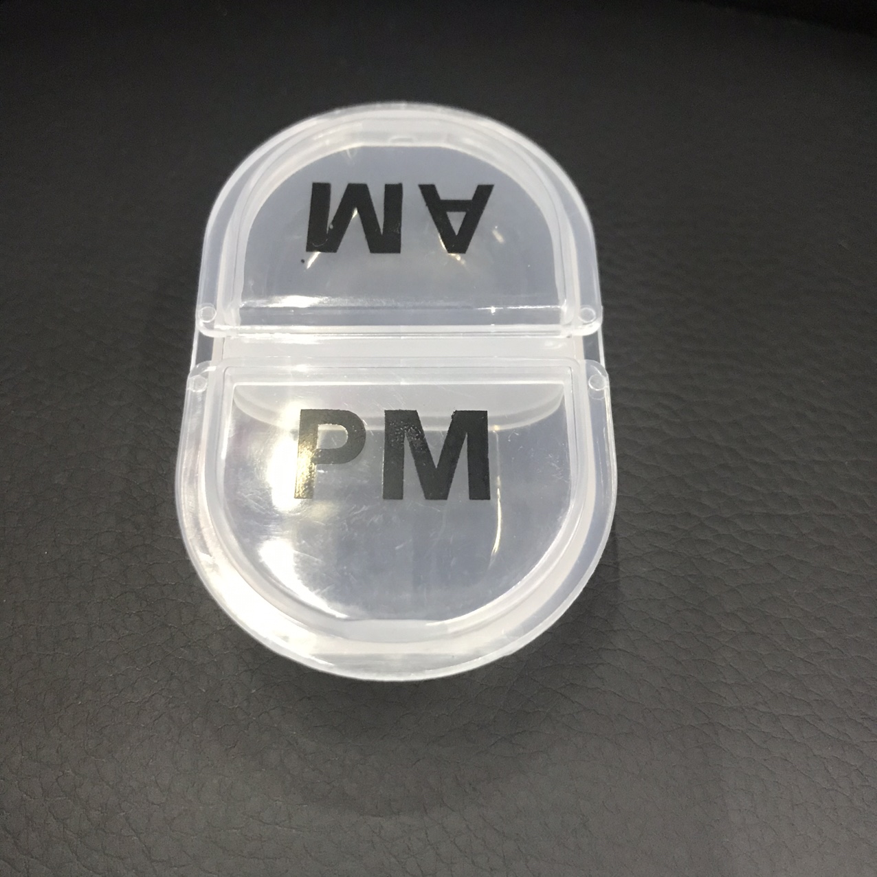 A two-compartment plastic pillbox thumbnail