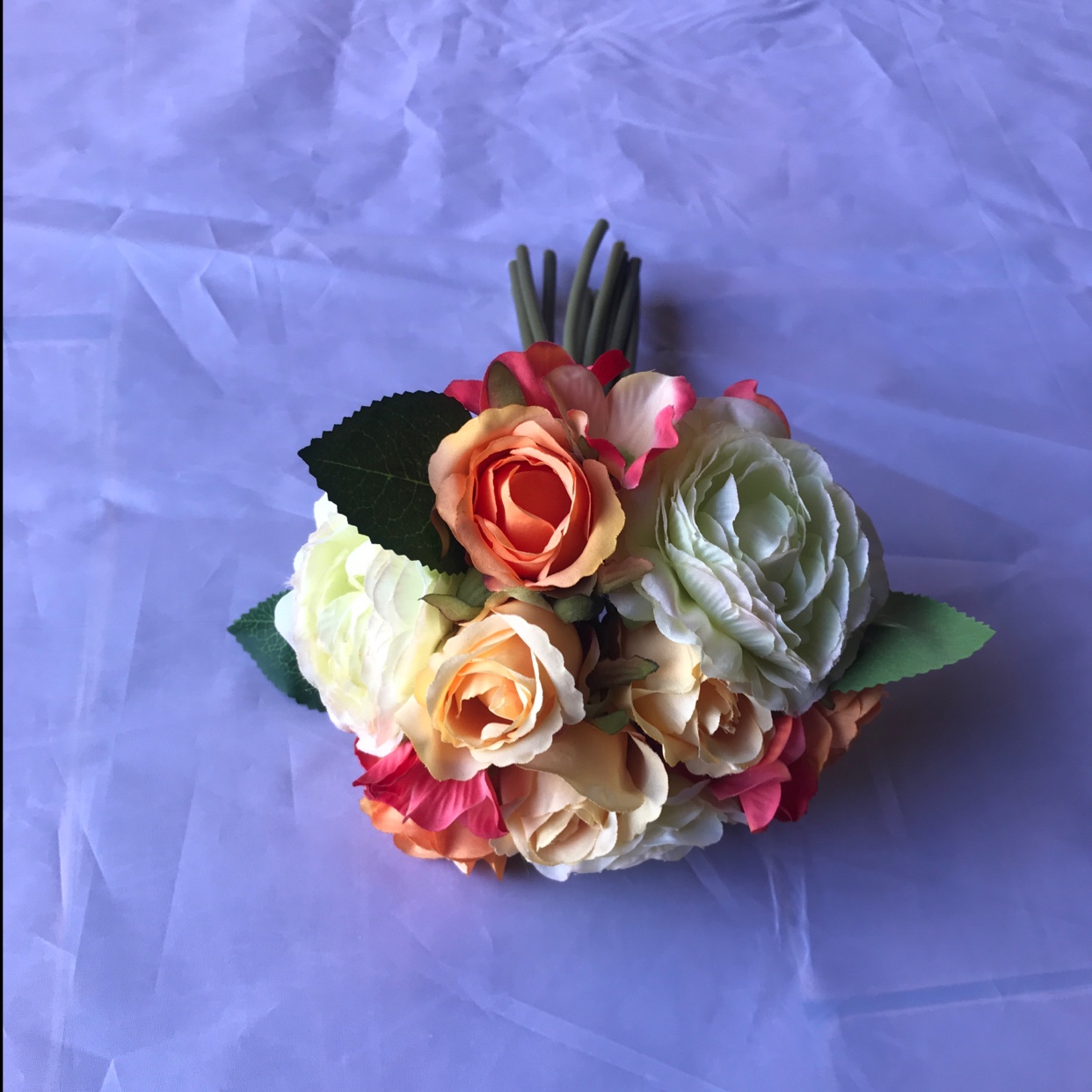 A combination of lotus and rose bouquets