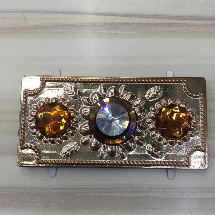 A young woman is focusing on replacing her belt with a new style of diamond jewelry with plastic clasp