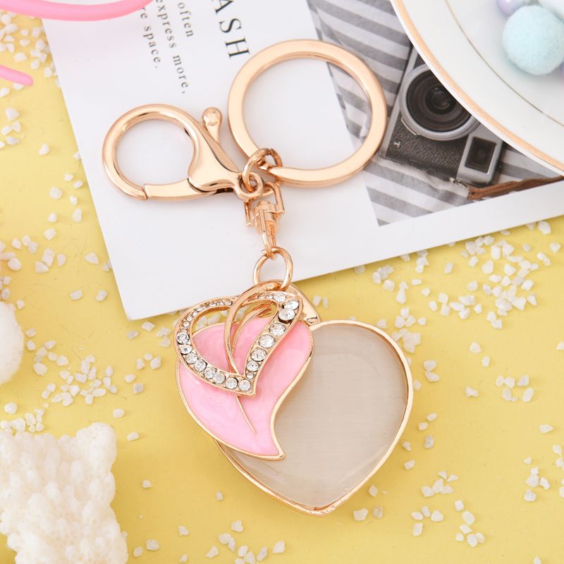 Valentine's Day cat's eye stone heart-shaped keychain car bag pendant metal handicraft gift