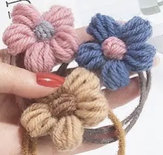 Hand-hooked woolen flowers in plum blossom