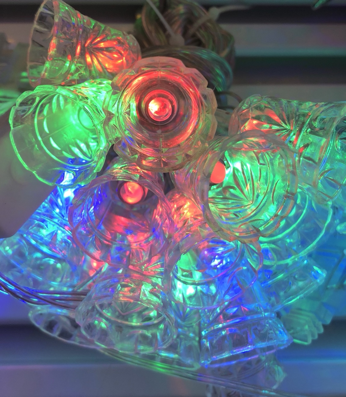 All citizens are adorned with plastic Christmas lights and bells