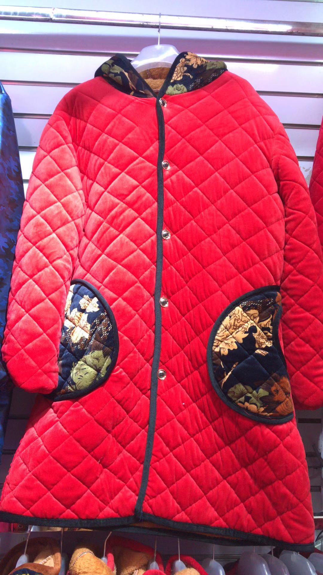 Ladies' long, bright red cotton-padded jacket with arched pockets