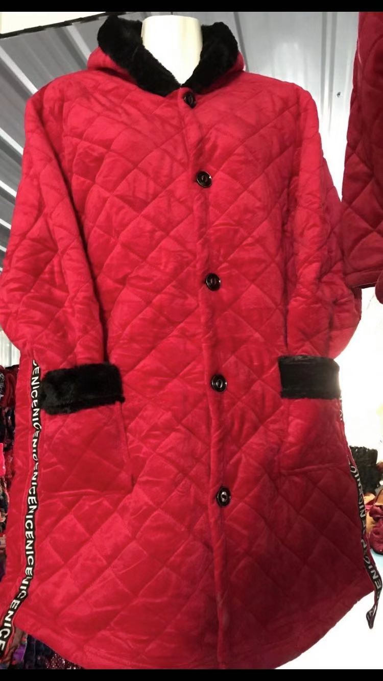 The lady is wearing a bright red cotton coat details Picture