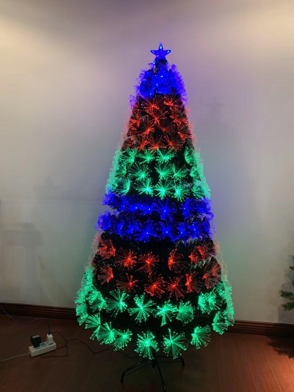 The Christmas lights of the green tree create a peaceful atmosphere, allowing me to feel the taste of peace and joy.