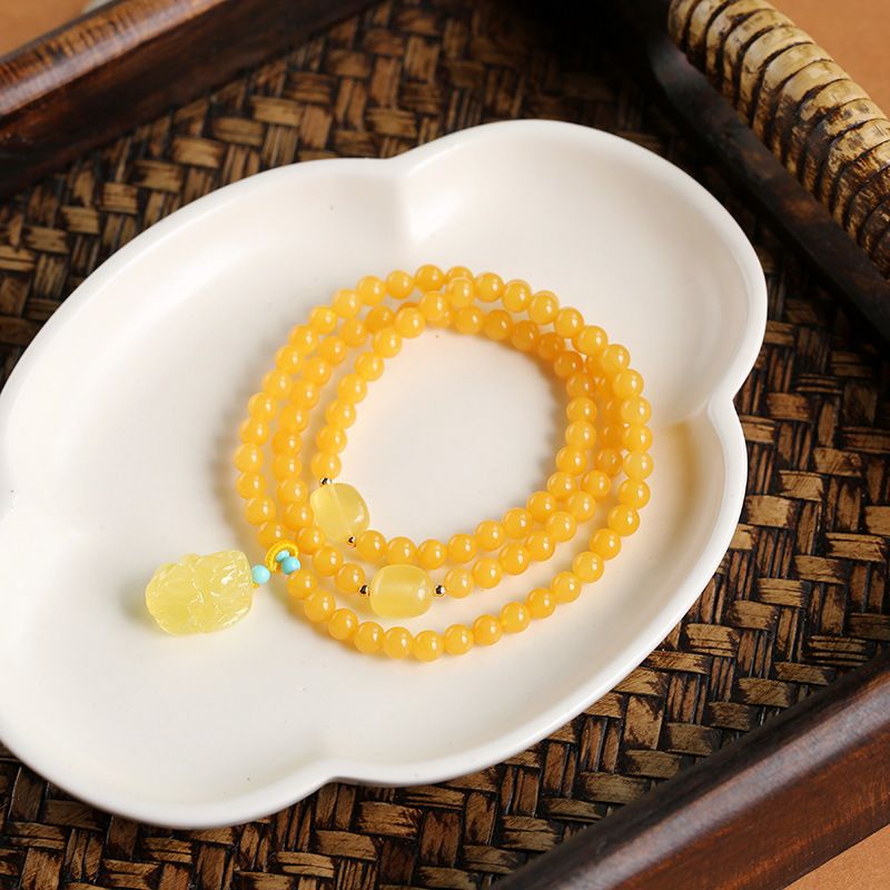 This is a simple and elegant women's jewelry bracelet with genuine Russian amber beads wound around three times. The supply is selling well