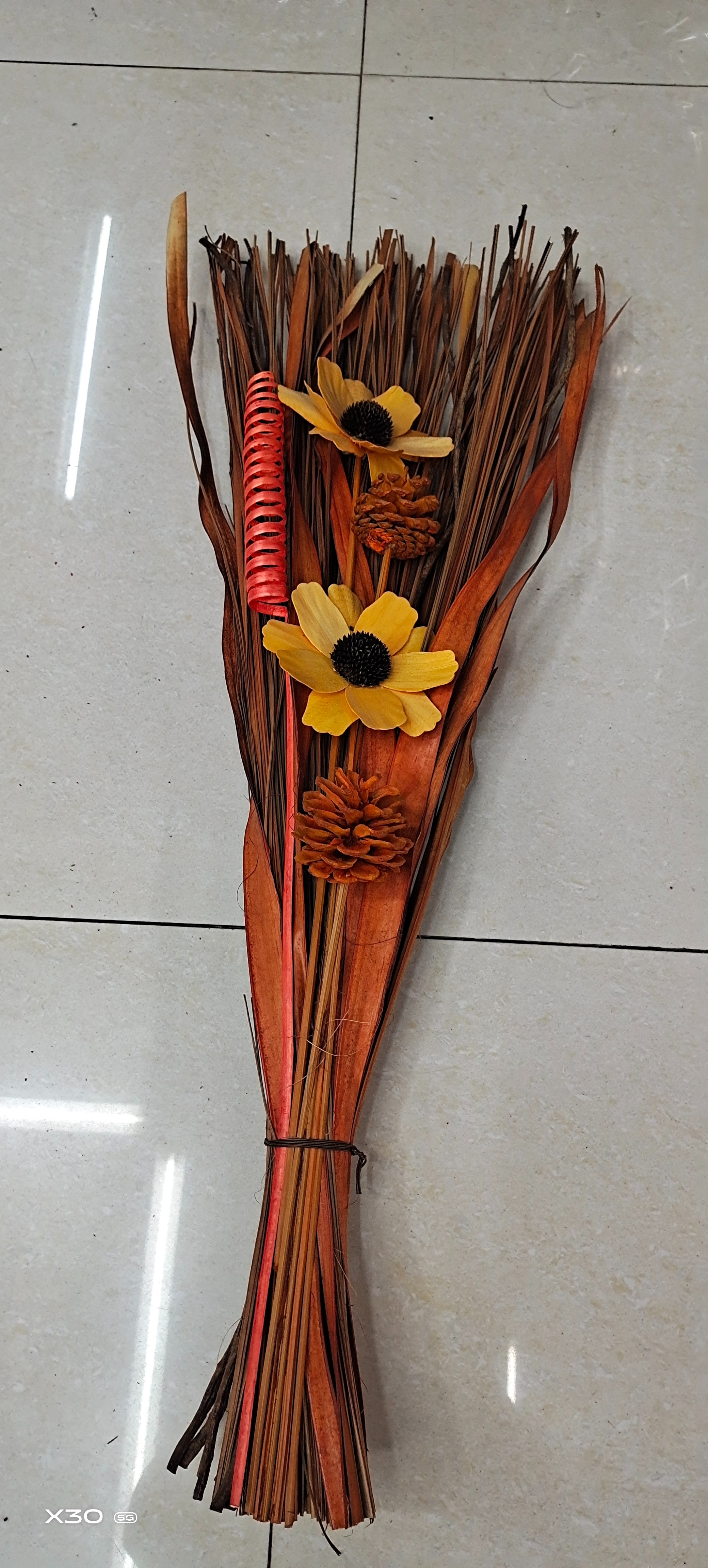 bouquet of dried fruits and dried flowers and wood chips from factories