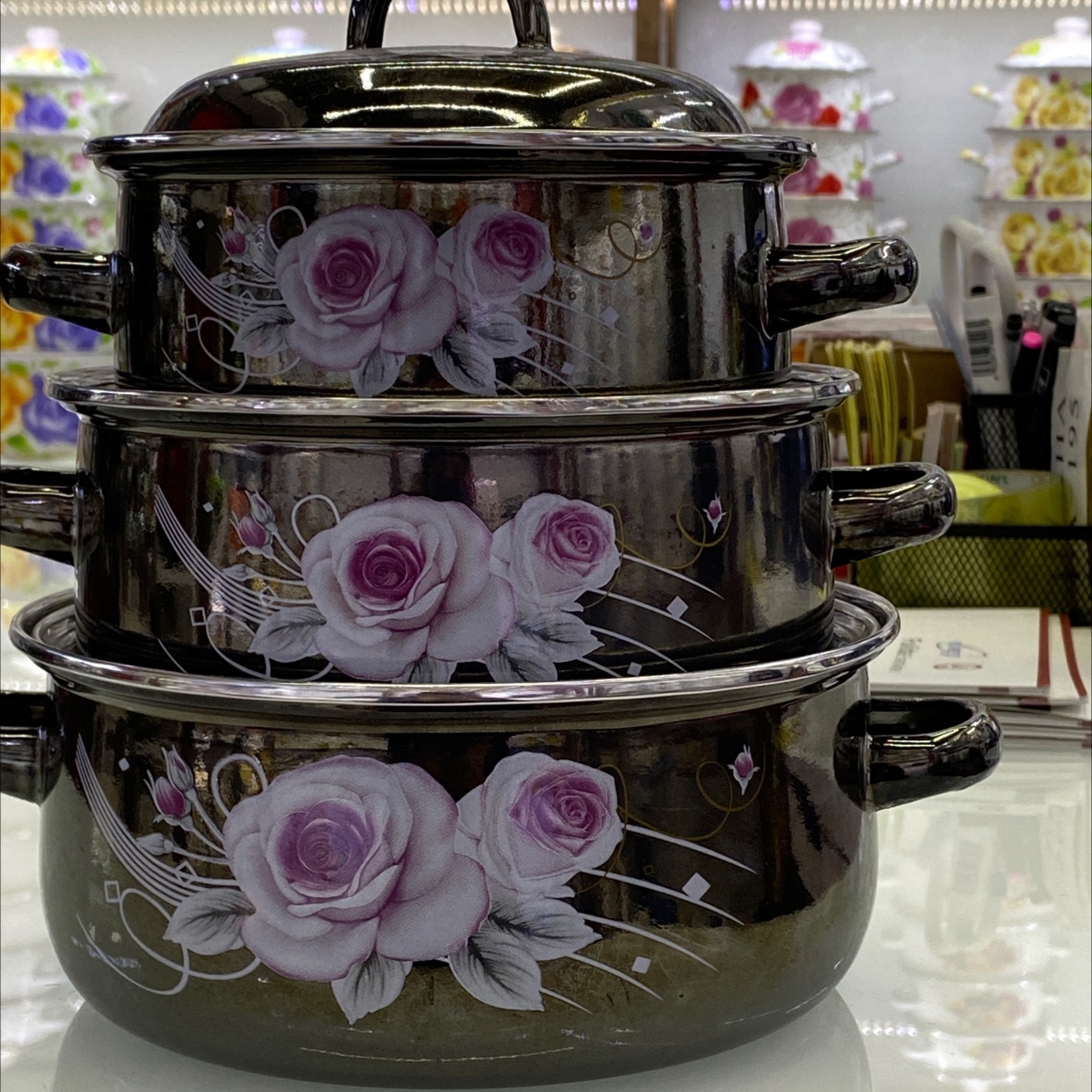 Three-piece set of enameled pot with iron lid