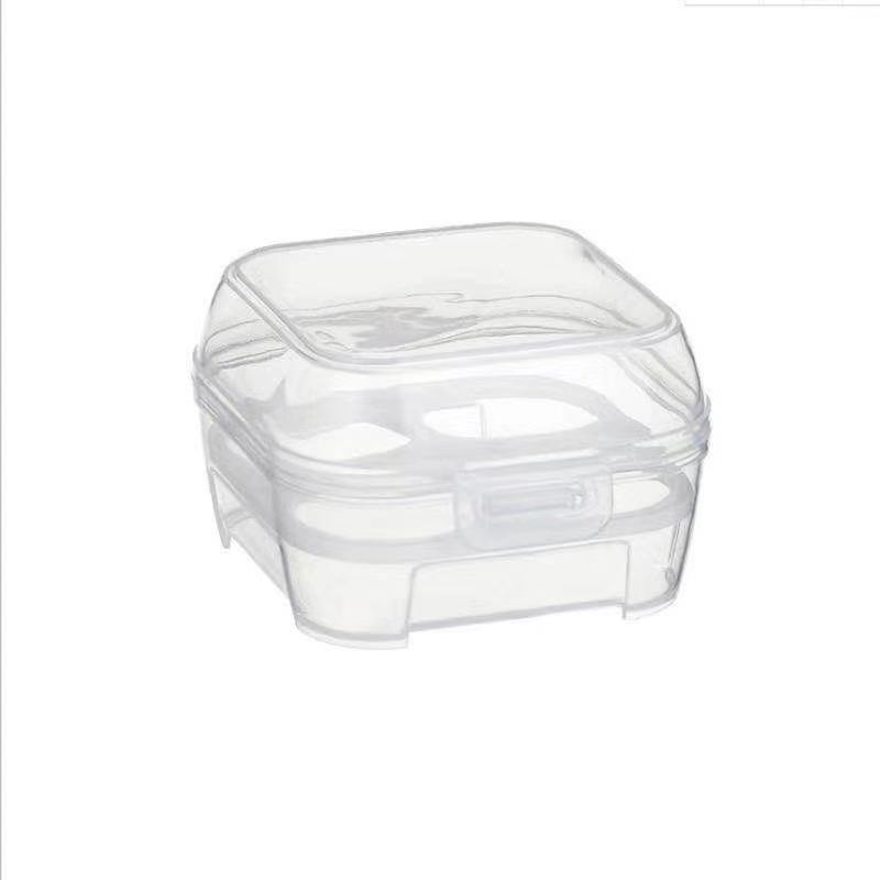 Four makeup eggs in a storage box