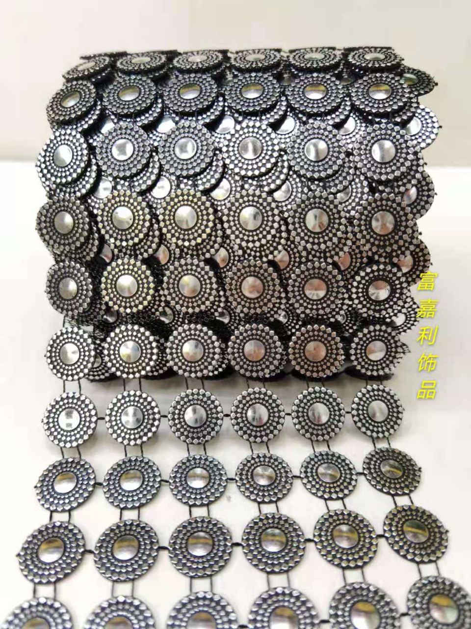 Four rows of large round black background with silver foil