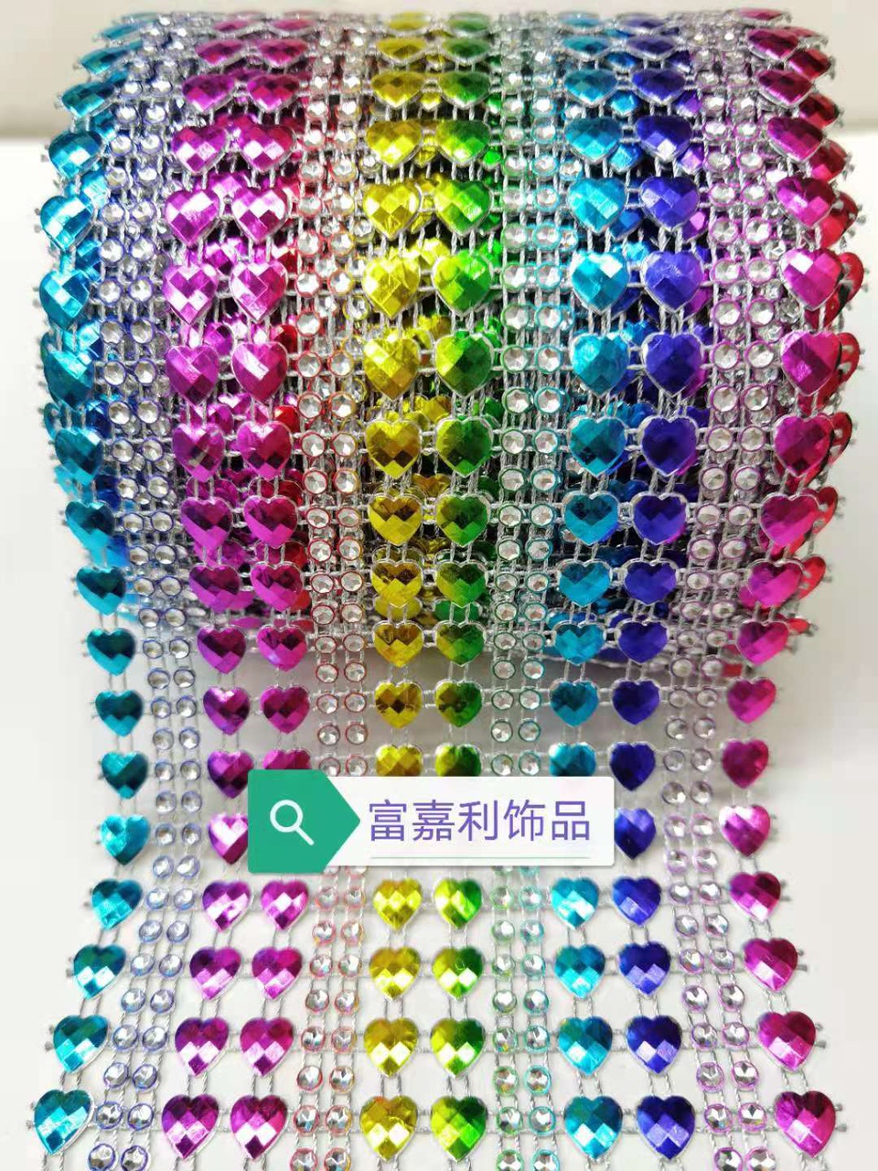 Eight rows of small hearts with reverse diamond-encrusted silver background and embossed in seven colors