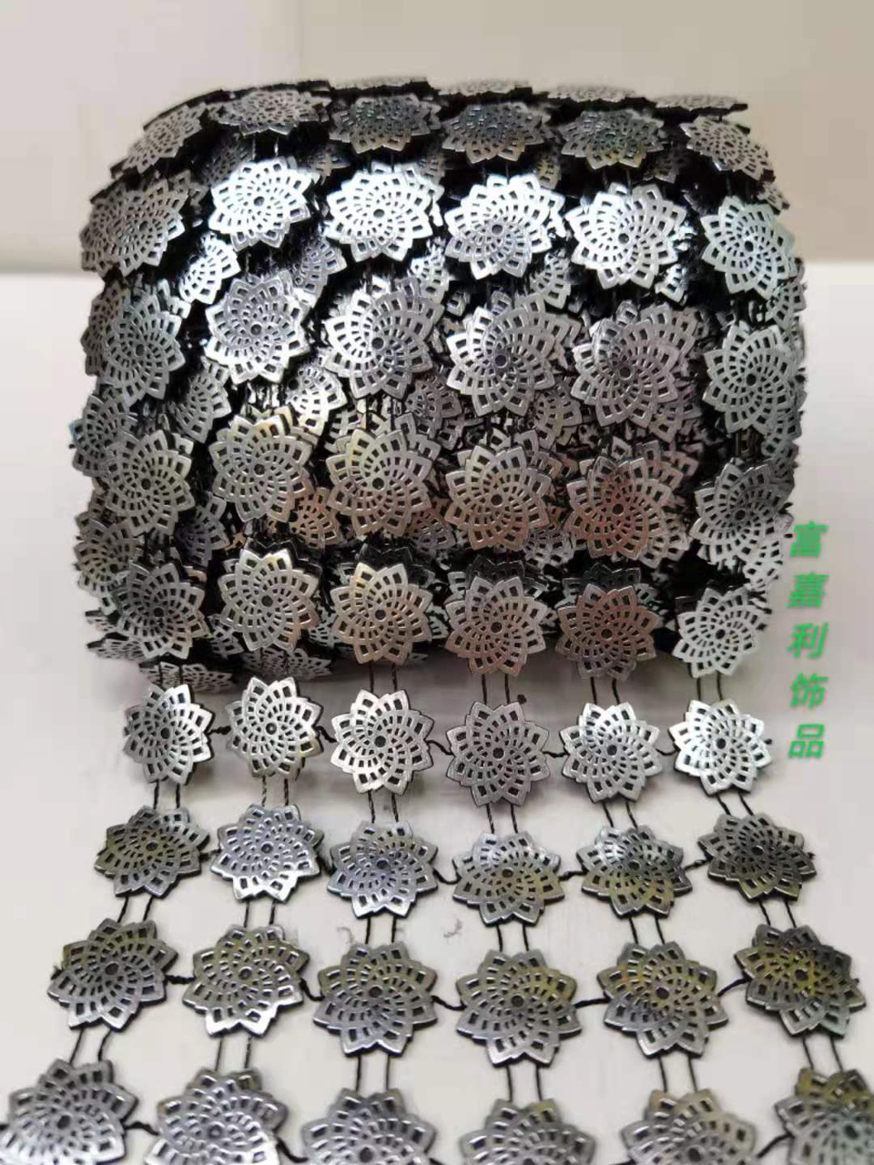 Six rows of black patterns with silver foil