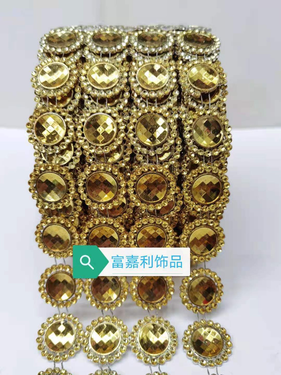 Four rows of large round gold pieces