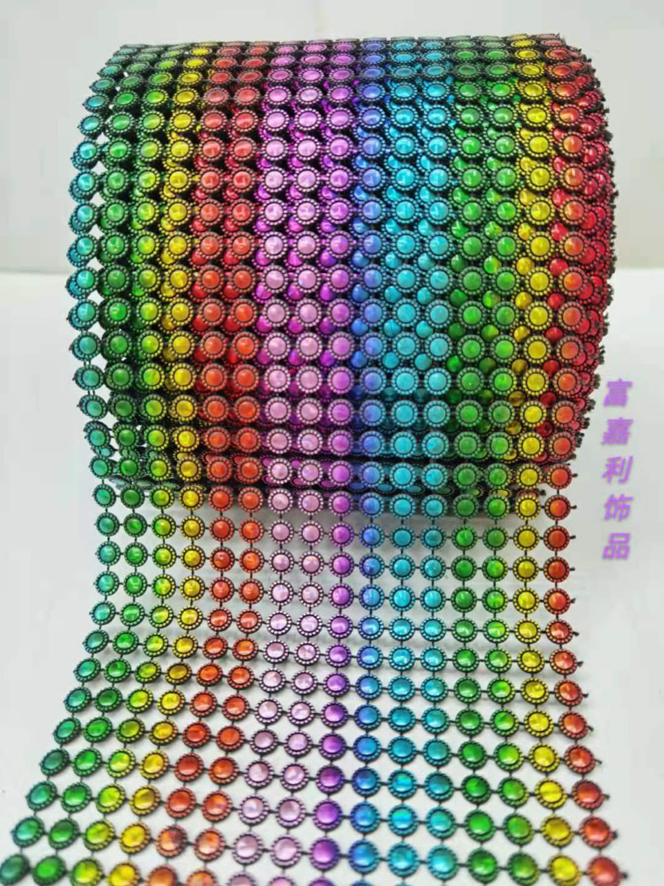 16 rows of small dots on a black background with seven colors embossed