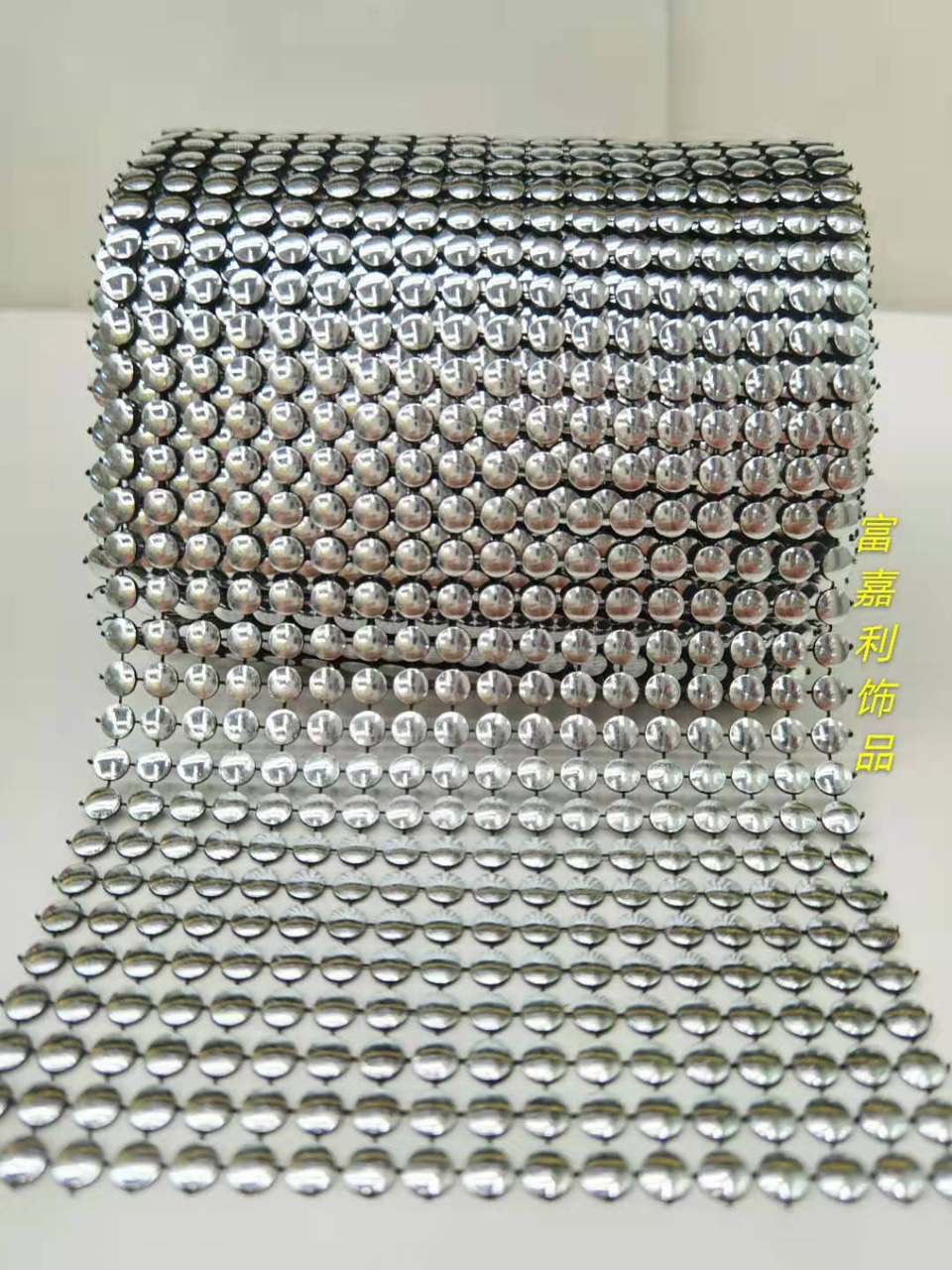 18 rows of semi-circular black background with silver foil