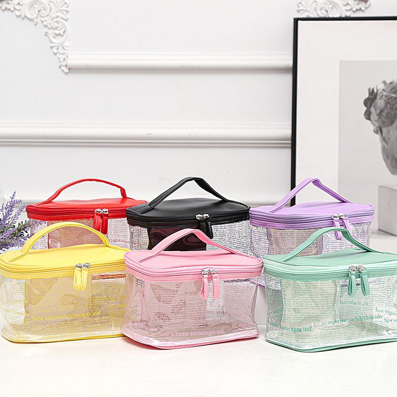 2020新款Ins热销韩版PVC透明化妆包源头厂货创意海报纹防水手提包图